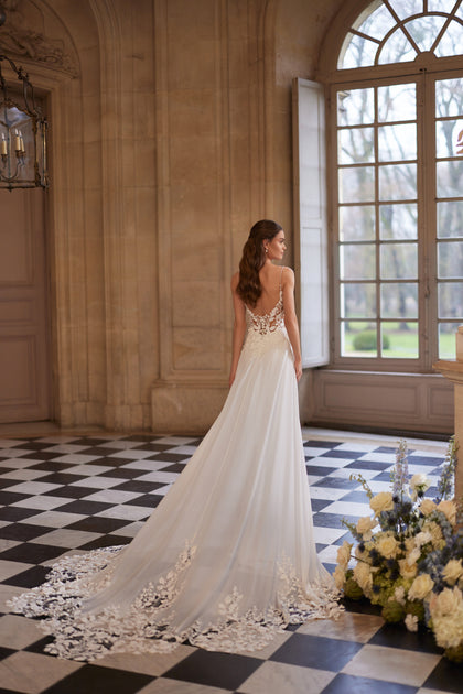 Agapia wedding dress from the Something Blue 2027 collection – a floral lace bodice, slender straps and airy chiffon skirt.