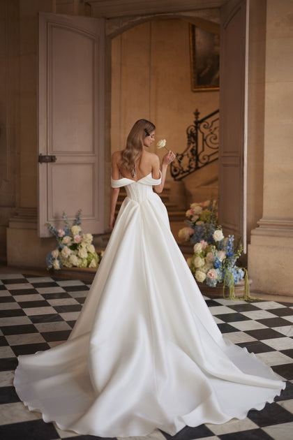 Alienor wedding dress – draped off-the-shoulder sleeves and a clean satin skirt.
