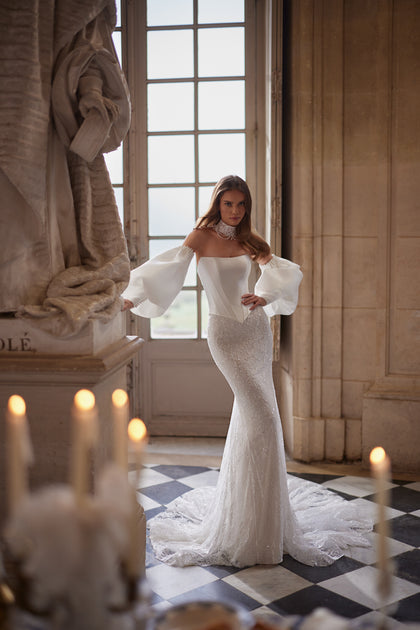 Anais wedding dress from the Something Blue 2027 collection – a sculptural lace bodice and voluminous off-the-shoulder sleeves.
