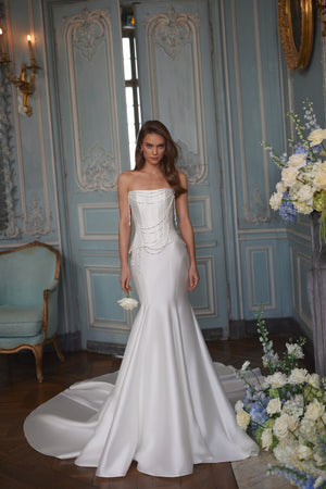 Armance wedding dress – A-line bridal gown with a corset bodice draped with strands of pearls.