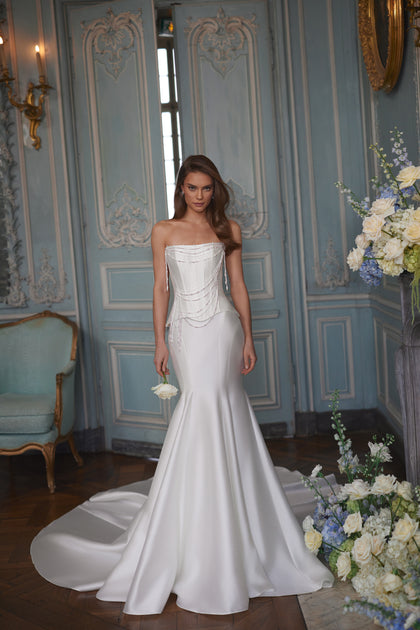 Armance wedding dress – A-line bridal gown with a corset bodice draped with strands of pearls.
