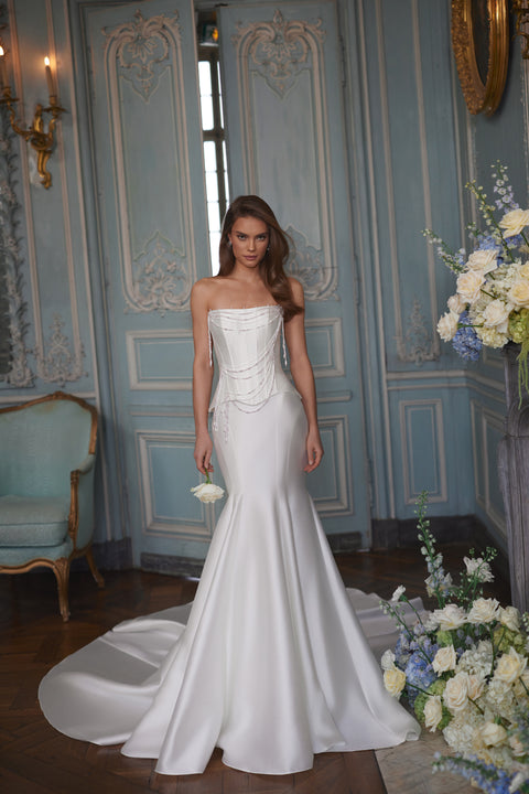 Armance wedding dress – A-line bridal gown with a corset bodice draped with strands of pearls.