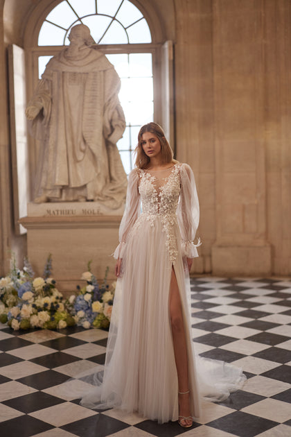 Blair wedding dress – a sheer floral bodice and airy voluminous sleeves.