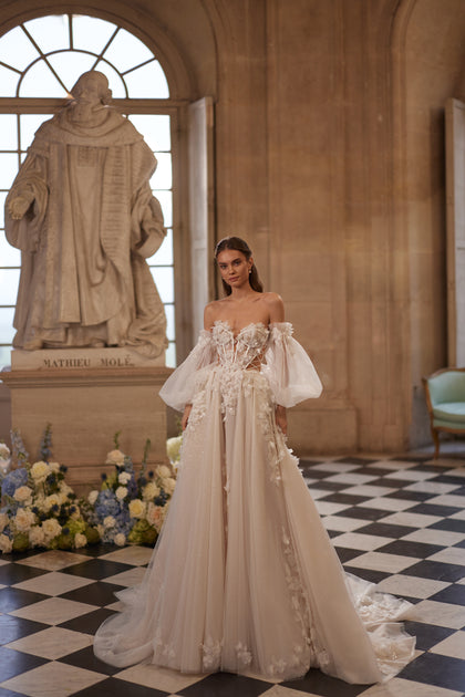 Celestine wedding dress – an open neckline, airy off-the-shoulder sleeves and 3D florals, DAMA Couture Something Blue 2027.