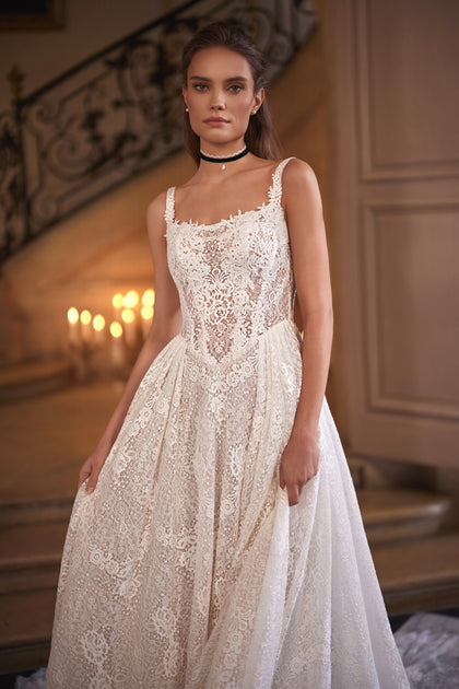 Chantira wedding dress – a softly squared neckline and all-over lace skirt.