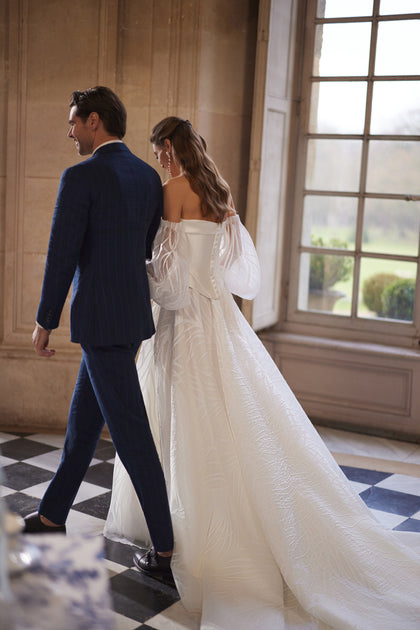 Charlize corset – A-line bridal gown with a clean strapless corset worn with voluminous off-the-shoulder sleeves.