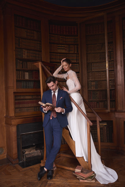 Greta wedding dress – mermaid wedding gown featuring a richly beaded strapless corset and draped satin skirt.