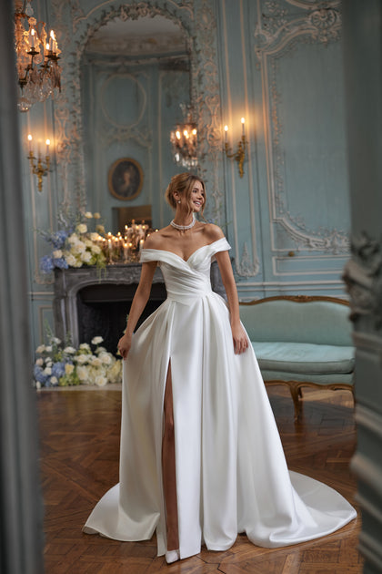 Heloise wedding dress – a softly draped off-the-shoulder neckline in clean satin.