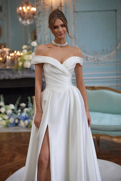 Heloise wedding dress – a softly draped off-the-shoulder neckline in clean satin, DAMA Couture Something Blue 2027.
