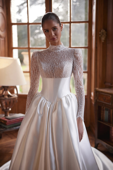 Maristella wedding dress – A-line bridal gown with a high-neck lace bodice with long sleeves and full satin skirt.