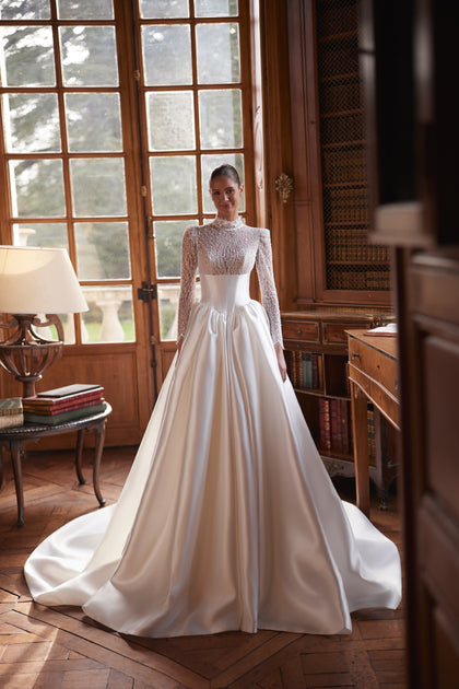 Maristella wedding dress – a high-neck lace bodice with long sleeves and full satin skirt.