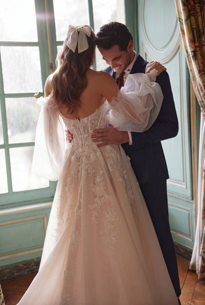Melusine wedding dress – a strapless botanical lace bodice and detachable tulle sleeves.