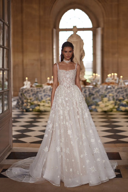 Milkyway wedding dress – A-line bridal gown with a square neckline and star-embroidered tulle skirt.