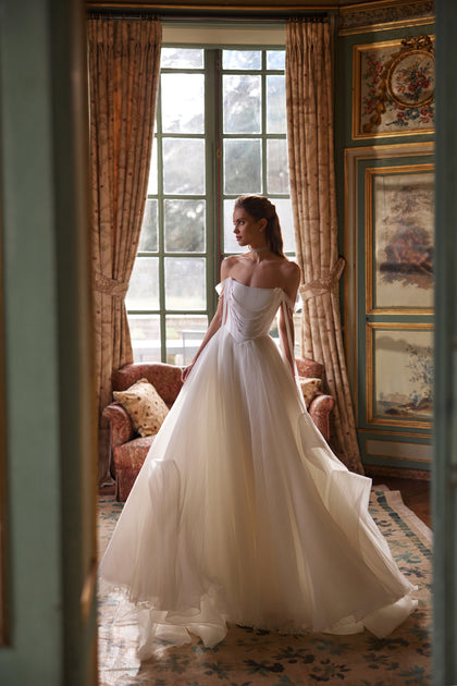 Nerina wedding dress from the Something Blue 2027 collection – jewellery-like detailing and off-the-shoulder tulle straps.