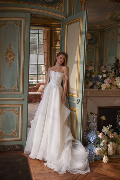 Nerina wedding dress – A-line silhouette with jewellery-like detailing and off-the-shoulder tulle straps.