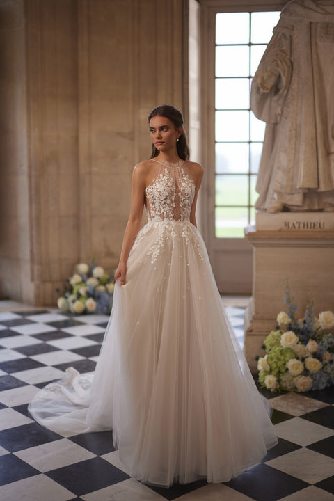 Nilla wedding dress – A-line bridal gown with a sheer high neckline and floral lace tulle skirt.