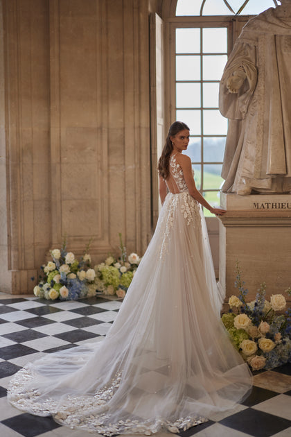 Nilla wedding dress – a sheer high neckline and floral lace tulle skirt, DAMA Couture Something Blue 2027.