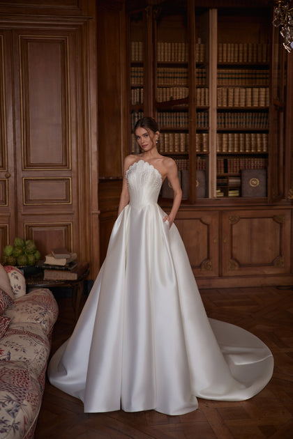 Shella wedding dress – a sculpted strapless corset and full satin skirt.