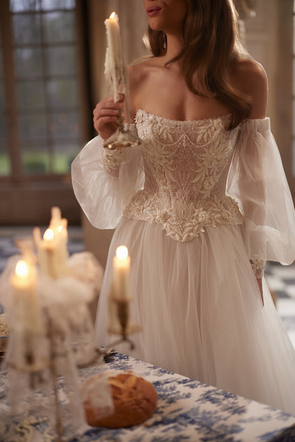 Tara corset + Tilda A-line skirt – A-line silhouette with a structured Tara corset with off-the-shoulder sleeves and the Tilda A-line skirt.