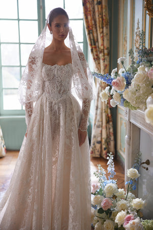 Thetis wedding dress – A-line silhouette with sheer corsetry, lace straps and an opulent lace skirt.