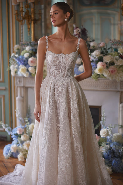 Thetis wedding dress – A-line wedding gown featuring sheer corsetry, lace straps and an opulent lace skirt.