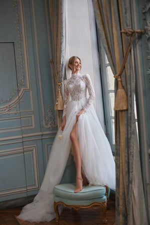 Tonia wedding dress – A-line bridal gown with a high neckline and long sheer lace sleeves.