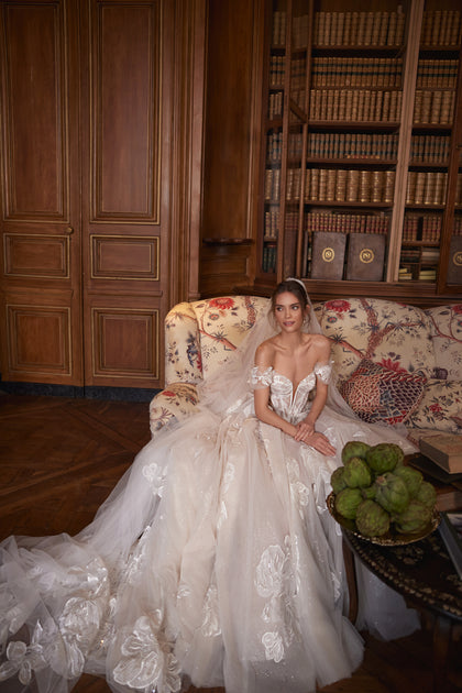 Vespera wedding dress from the Something Blue 2027 collection – an off-the-shoulder corset with a plunging neckline and sheer boning.