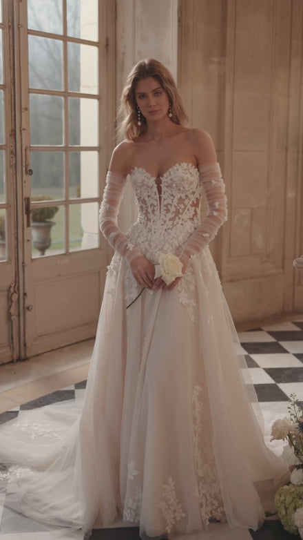 Video of the Ines wedding dress in motion – A-line silhouette with a sculpted strapless bodice and floral lace tulle skirt.