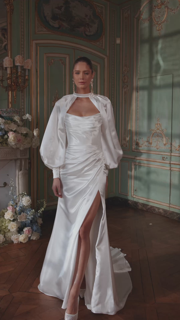 Video of the Sodden wedding dress in motion – mermaid silhouette with a softly draped strapless neckline and high slit in fluid satin.