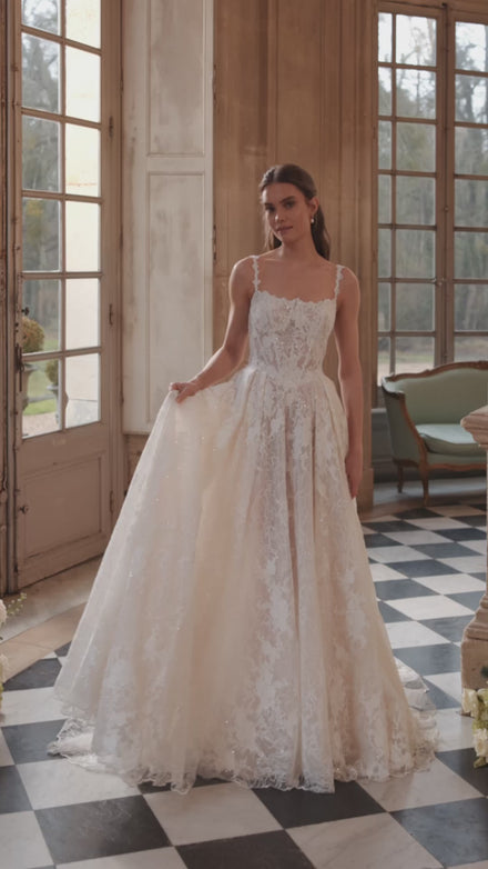Video of the Thetis wedding dress – sheer corsetry, lace straps and an opulent lace skirt.