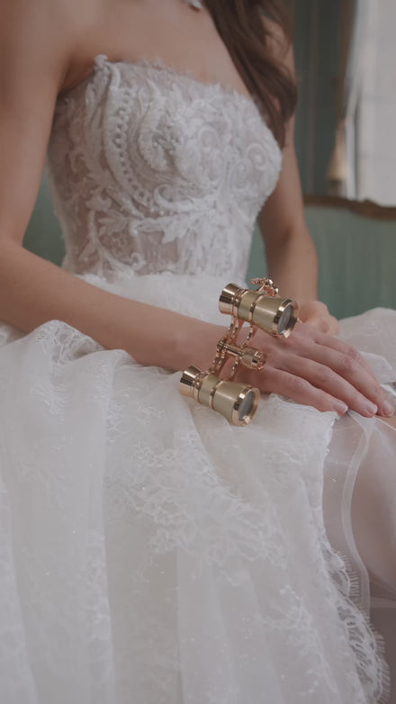 Video of the Barbarella wedding dress in motion – A-line silhouette with a strapless sculpted bodice and floral lace skirt.