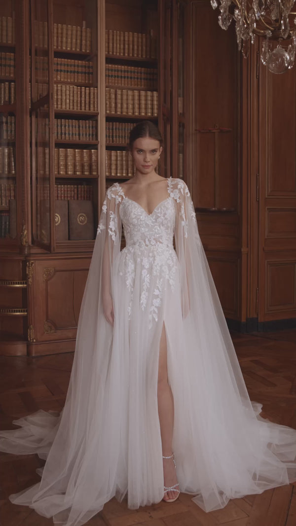 Video of the Veloria wedding dress in motion – A-line silhouette with a V-neckline, floral straps and layered tulle skirt.
