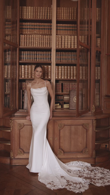 Video of the Valerie wedding dress in motion – mermaid silhouette with spaghetti straps and a softly draped cowl neckline.