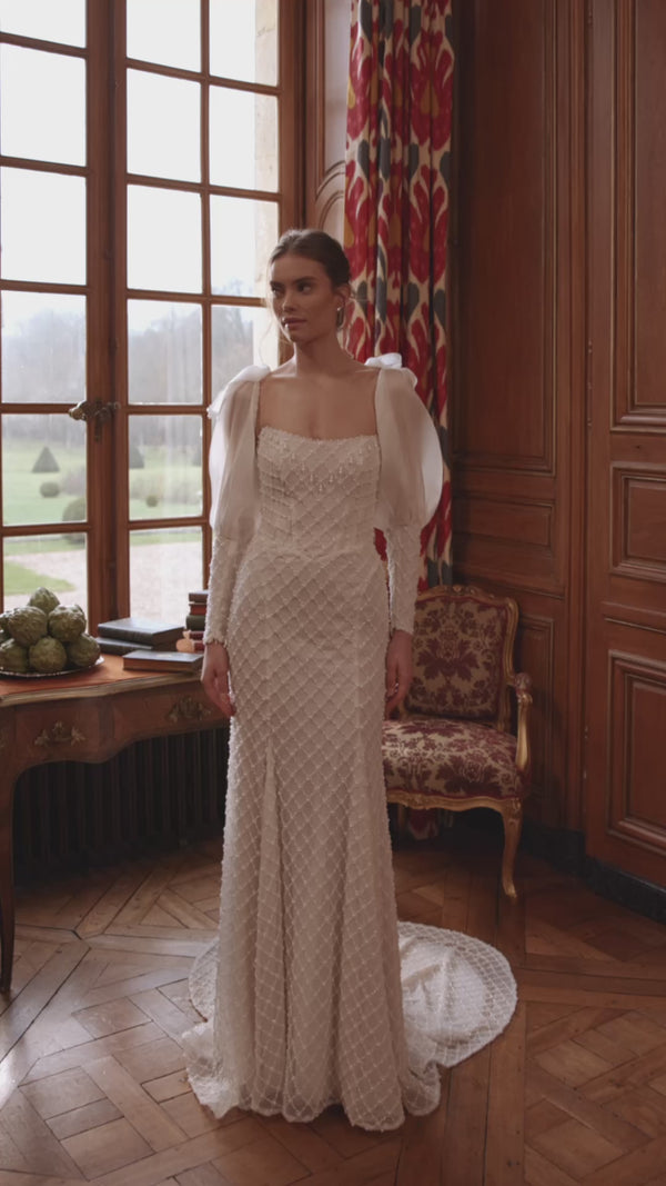 Video of the Chanin wedding dress in motion – mermaid silhouette with a clean strapless neckline and beaded fitted silhouette.