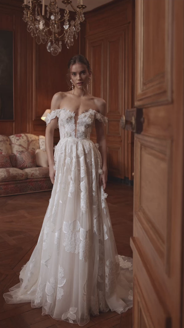 Video of the Hydragenea wedding dress in motion – A-line silhouette with a plunging neckline and off-the-shoulder floral straps.