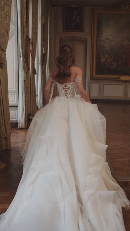 Video of the Nerina wedding dress – jewellery-like detailing and off-the-shoulder tulle straps.
