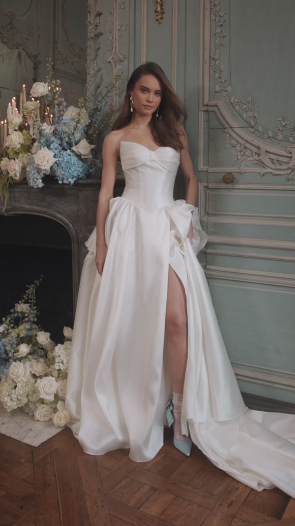 Video of the Alizee wedding dress in motion – A-line silhouette with a folded strapless neckline and draped satin skirt.
